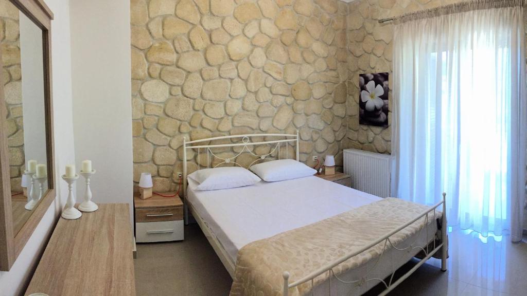 Posteľ alebo postele v izbe v ubytovaní Amfithea House