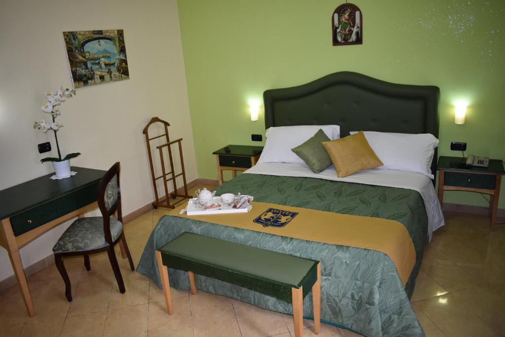 Postel nebo postele na pokoji v ubytování Hotel Ristorante Amitrano