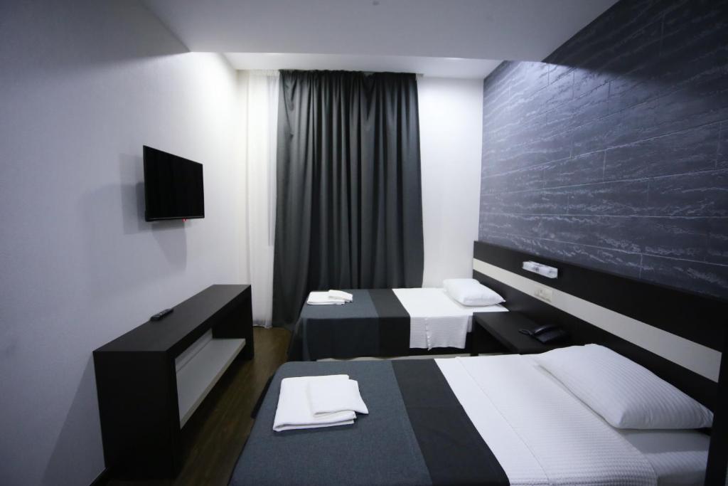 Voodi või voodid majutusasutuse West Tower Hotel toas