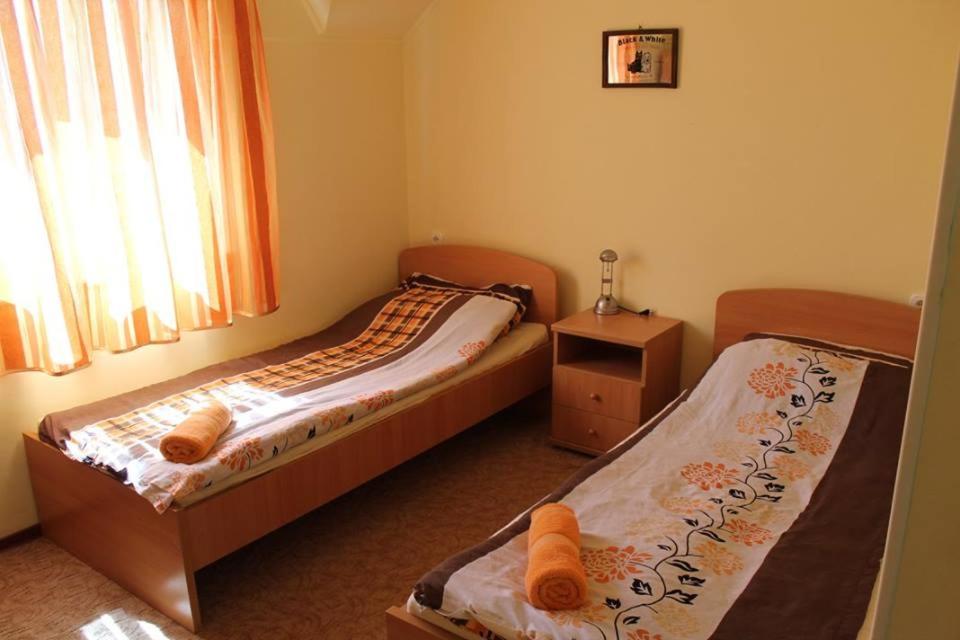 Postel nebo postele na pokoji v ubytování Király Lovastanya Panzió