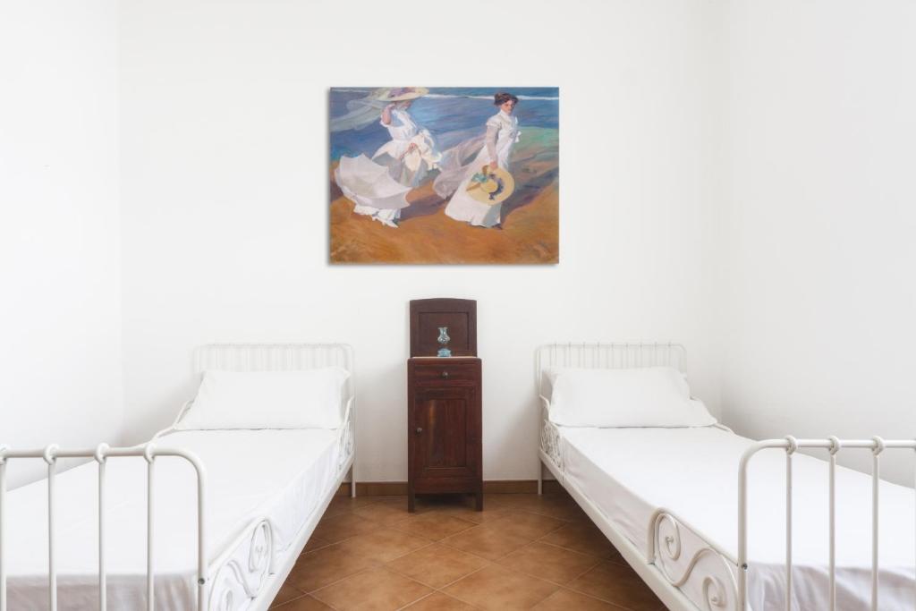 Postel nebo postele na pokoji v ubytování Casetta Canale delle Donne
