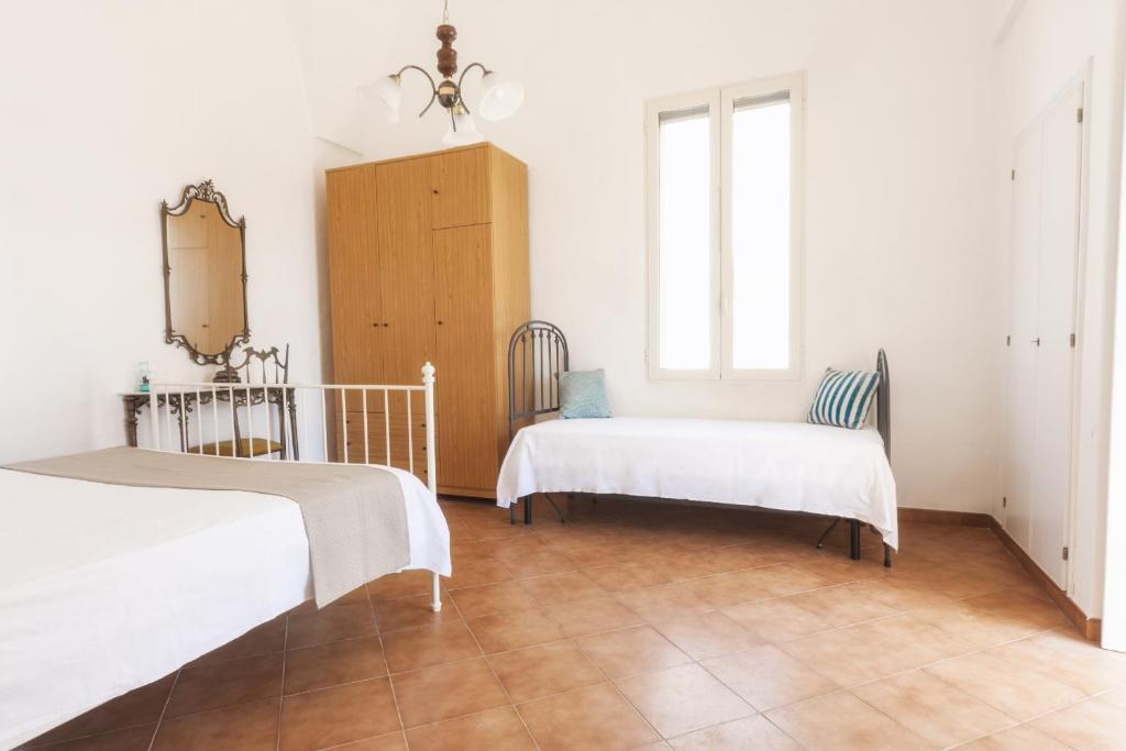 Postel nebo postele na pokoji v ubytování Casetta Canale delle Donne
