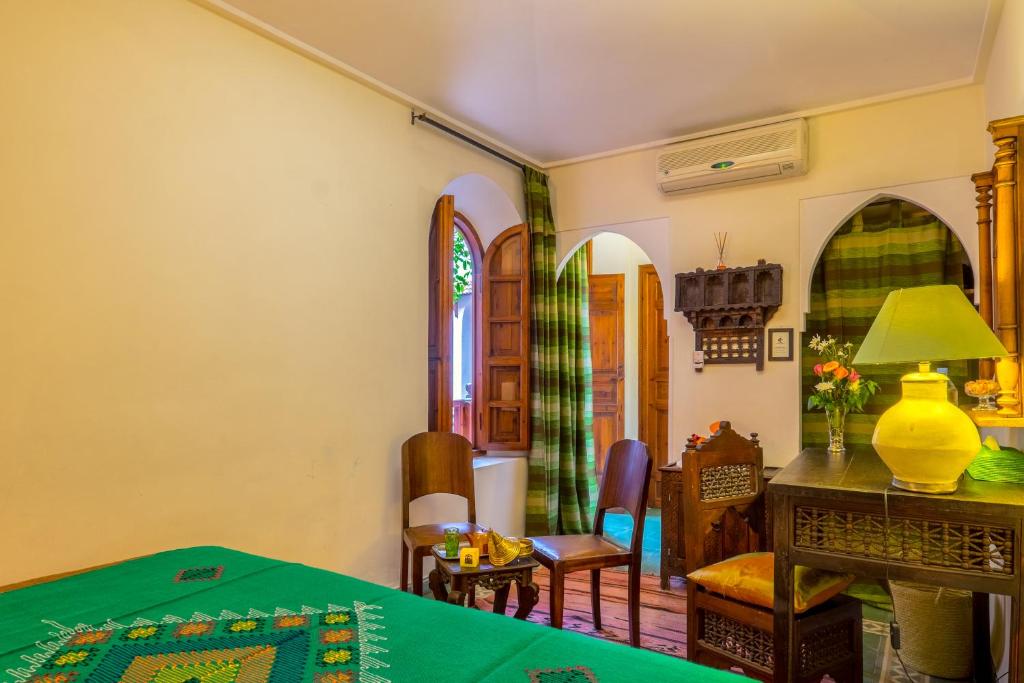 Postel nebo postele na pokoji v ubytování Riad Sable Chaud