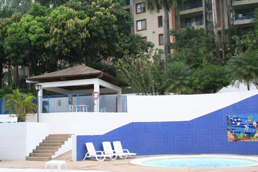 Bazén v ubytování girardot resort apto102 nebo v jeho okolí