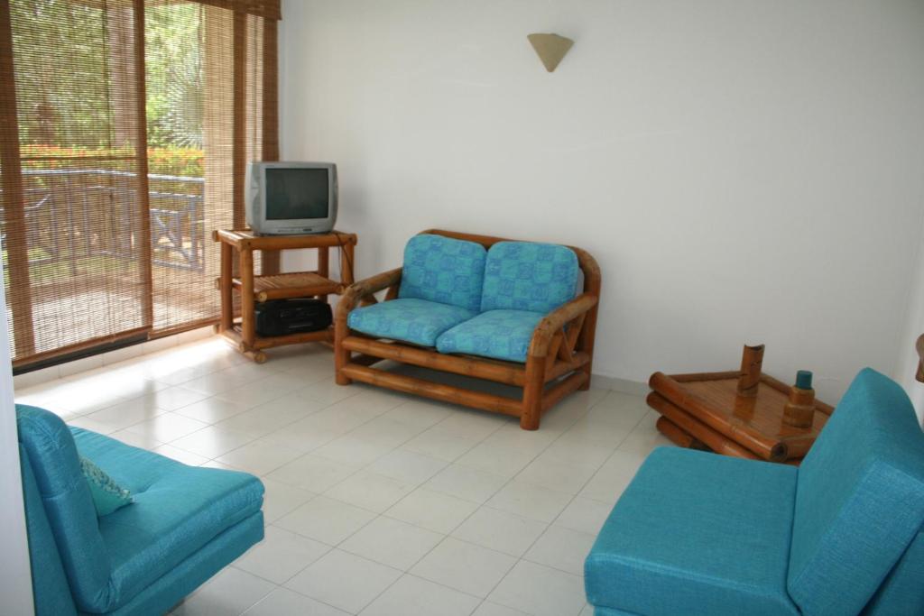 TV a/nebo společenská místnost v ubytování girardot resort apto102