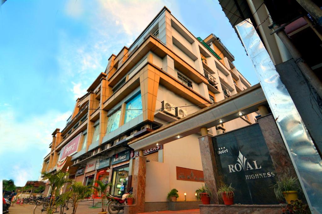 a building on the side of a street at Hotel Royal Highness in Tinsukia