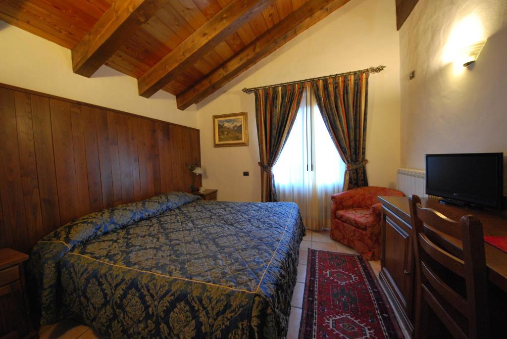 Postel nebo postele na pokoji v ubytování Hotel Bellevue