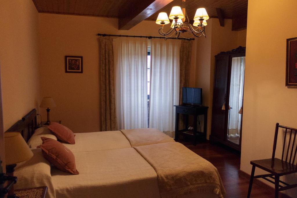 A bed or beds in a room at Casa de Barreiro