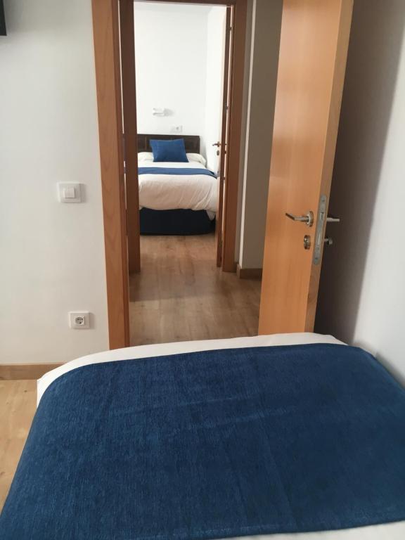 Postel nebo postele na pokoji v ubytování Hotel Marxant