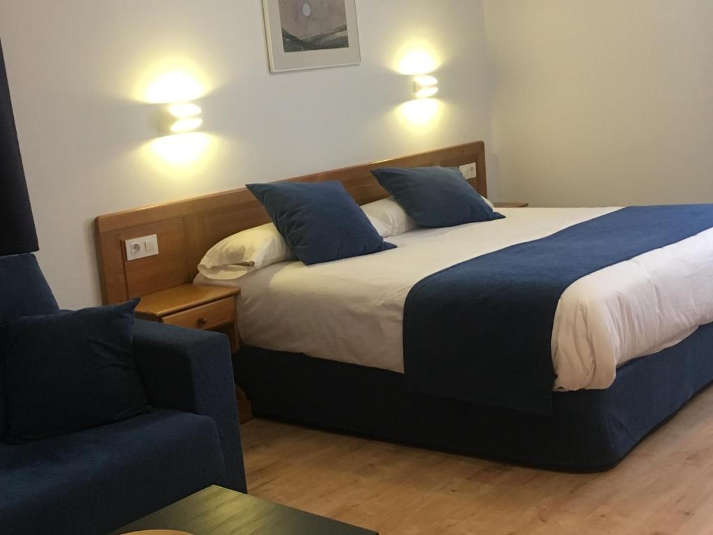 Postel nebo postele na pokoji v ubytování Hotel Marxant