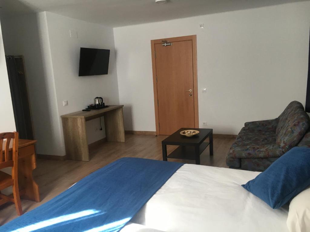 Postel nebo postele na pokoji v ubytování Hotel Marxant