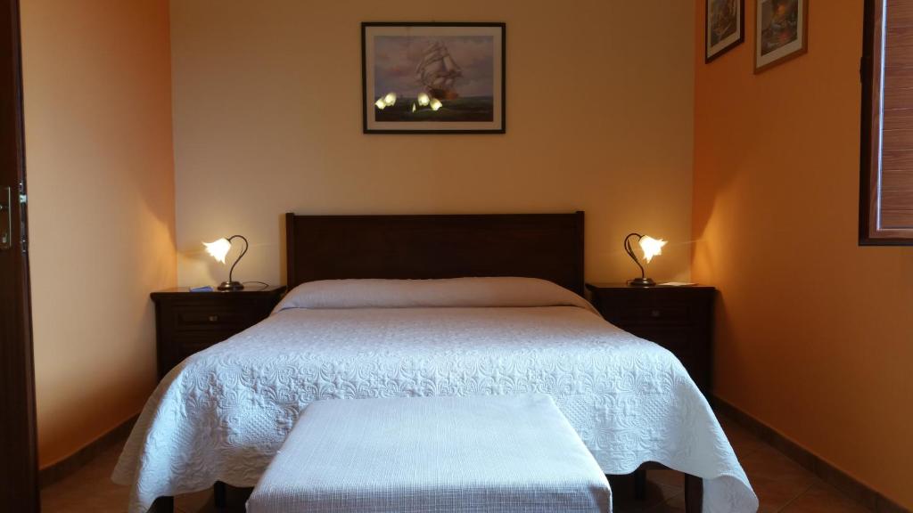Postel nebo postele na pokoji v ubytování B&B A Robba de Pupi