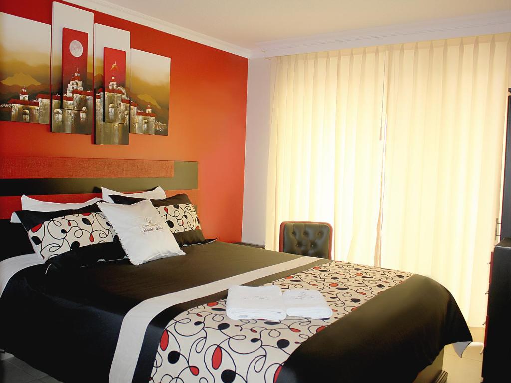 Postel nebo postele na pokoji v ubytování Hotel Tababela Land