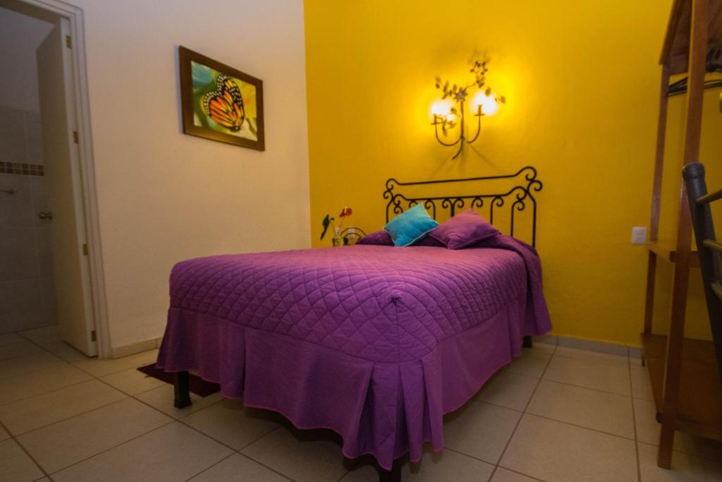 Postel nebo postele na pokoji v ubytování Hotel Posada Santo Niño