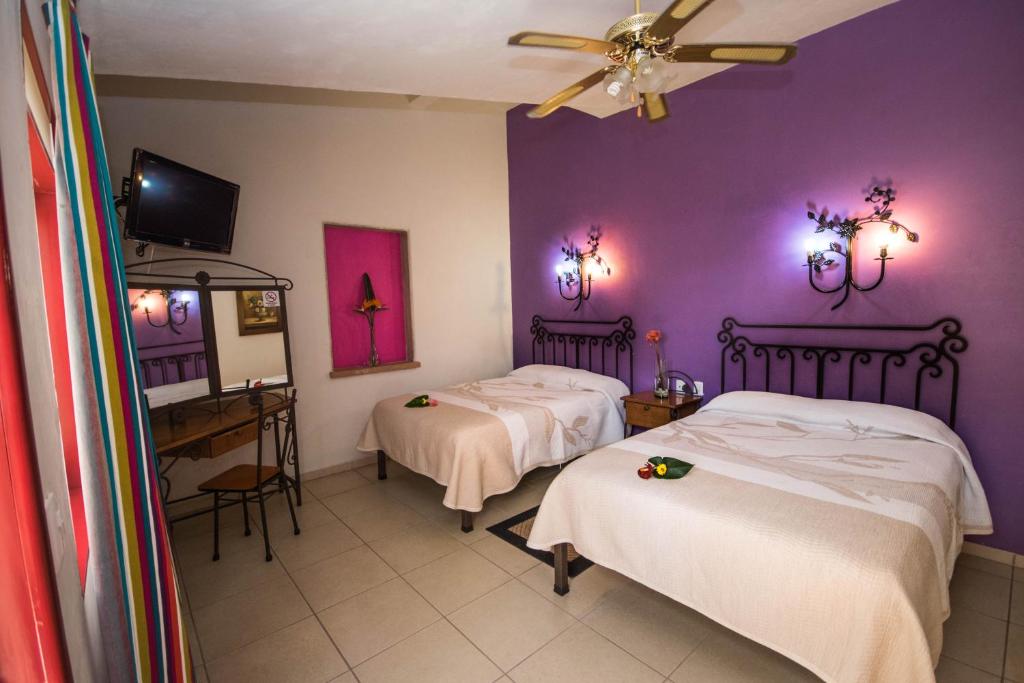 Postel nebo postele na pokoji v ubytování Hotel Posada Santo Niño