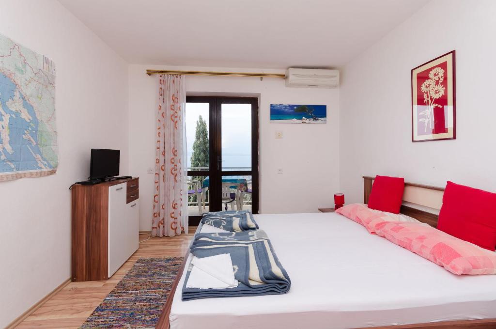 Posteľ alebo postele v izbe v ubytovaní Apartments and Room Luka