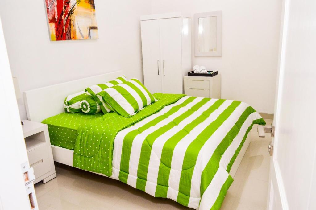 Postel nebo postele na pokoji v ubytování Omah Melati - Vacation Home