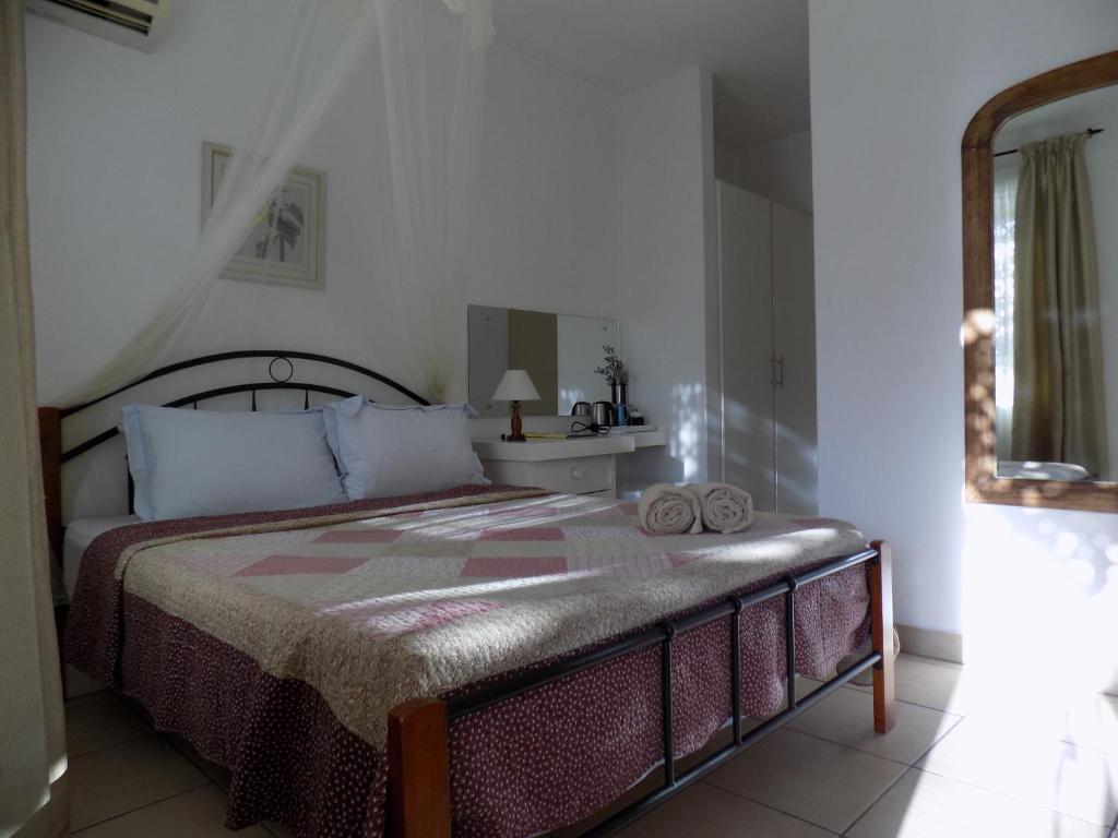 Postel nebo postele na pokoji v ubytování Villa Osumare Guest House