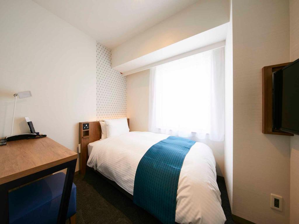 Postel nebo postele na pokoji v ubytování Hotel Intergate Tokyo Kyobashi