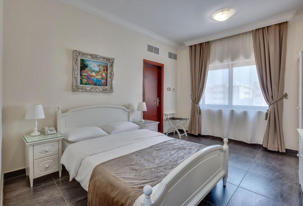 Postel nebo postele na pokoji v ubytování Royal Hotel