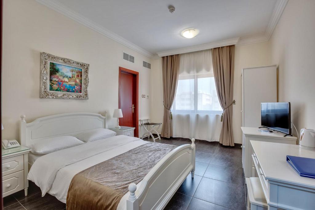 Postel nebo postele na pokoji v ubytování Royal Hotel