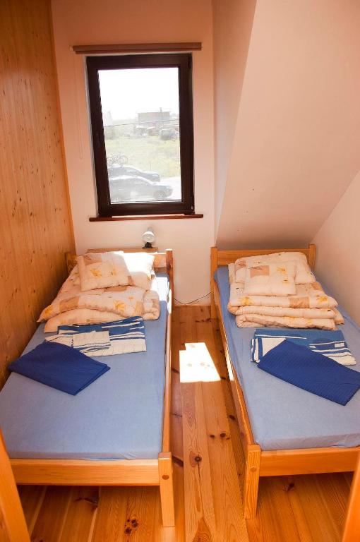 Postel nebo postele na pokoji v ubytování Apartamenty pod dębem