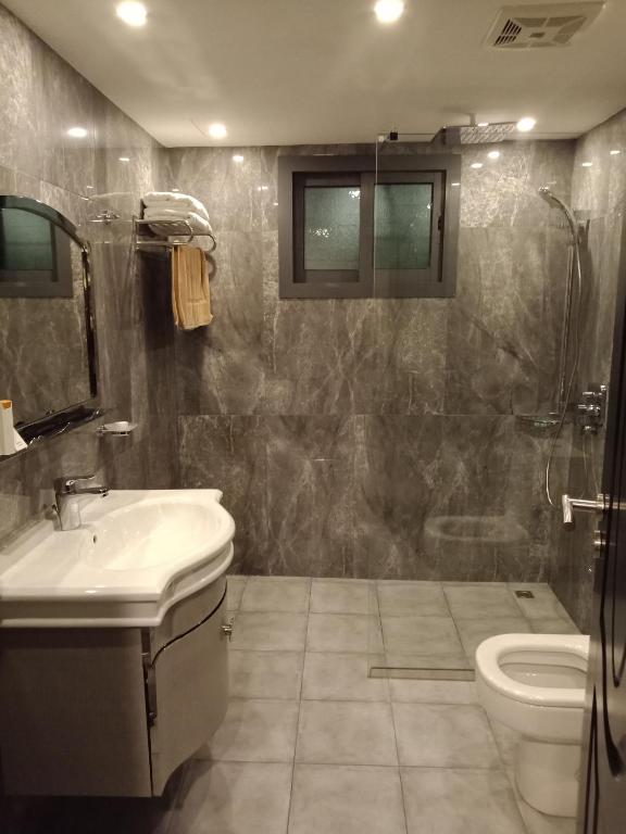 Koupelna v ubytování Le Park Hotel