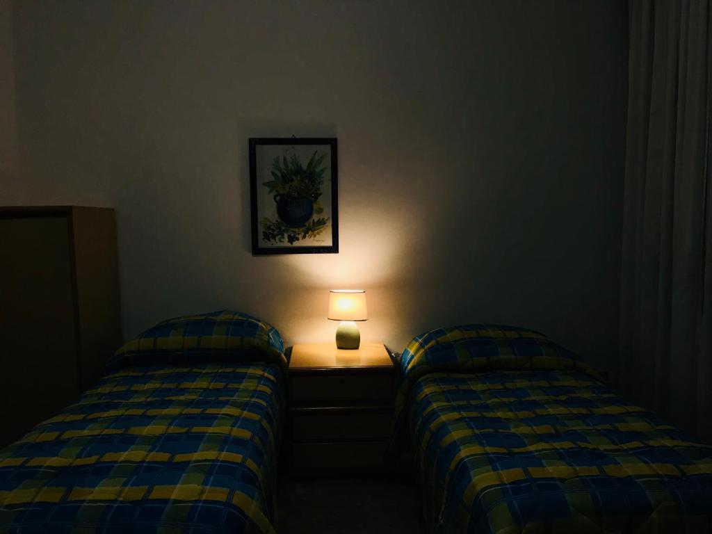 Postel nebo postele na pokoji v ubytování Casa Vacanze Basilicata da Giannino