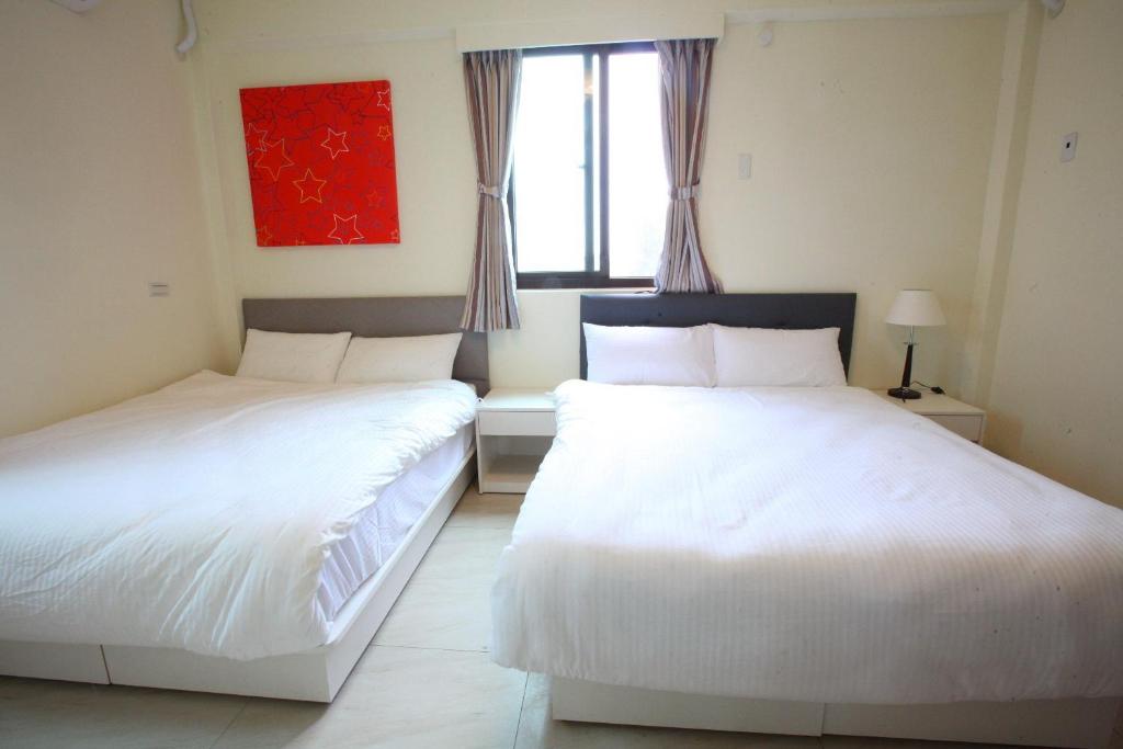 Postel nebo postele na pokoji v ubytování Kinmen Line In Bed and Breakfast