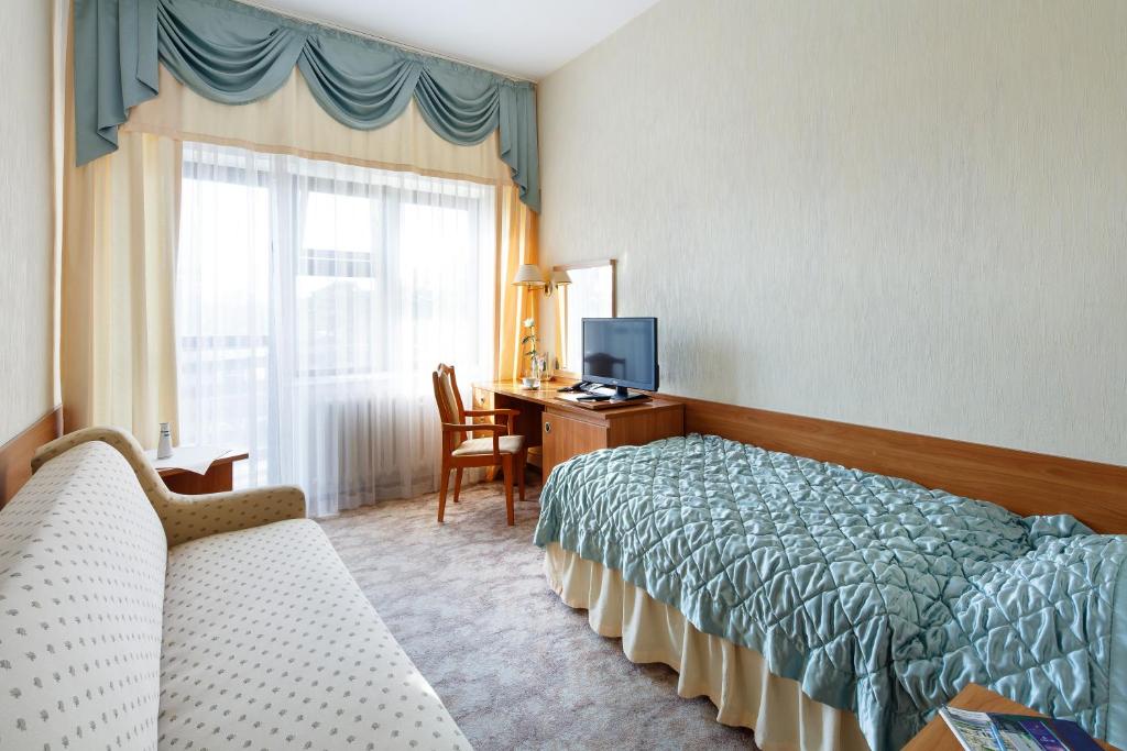 Postel nebo postele na pokoji v ubytování Hotel Wodnik