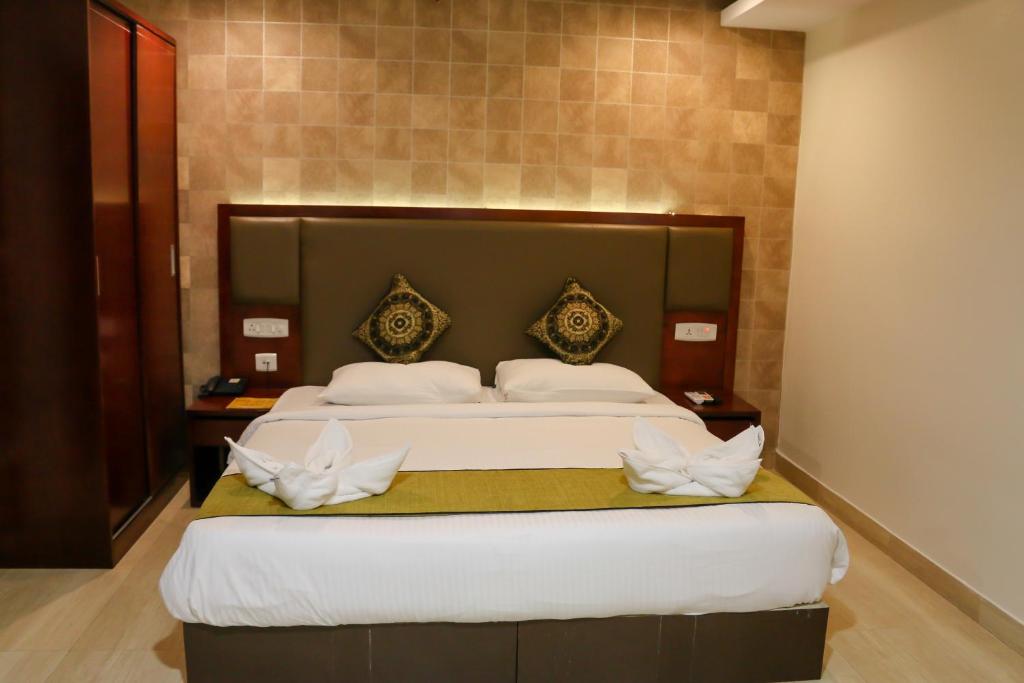 Postel nebo postele na pokoji v ubytování Hotel Winsar Park