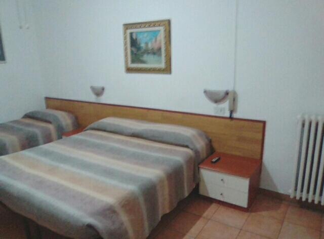 Postel nebo postele na pokoji v ubytování Albergo Cavour SELF CHECK-IN