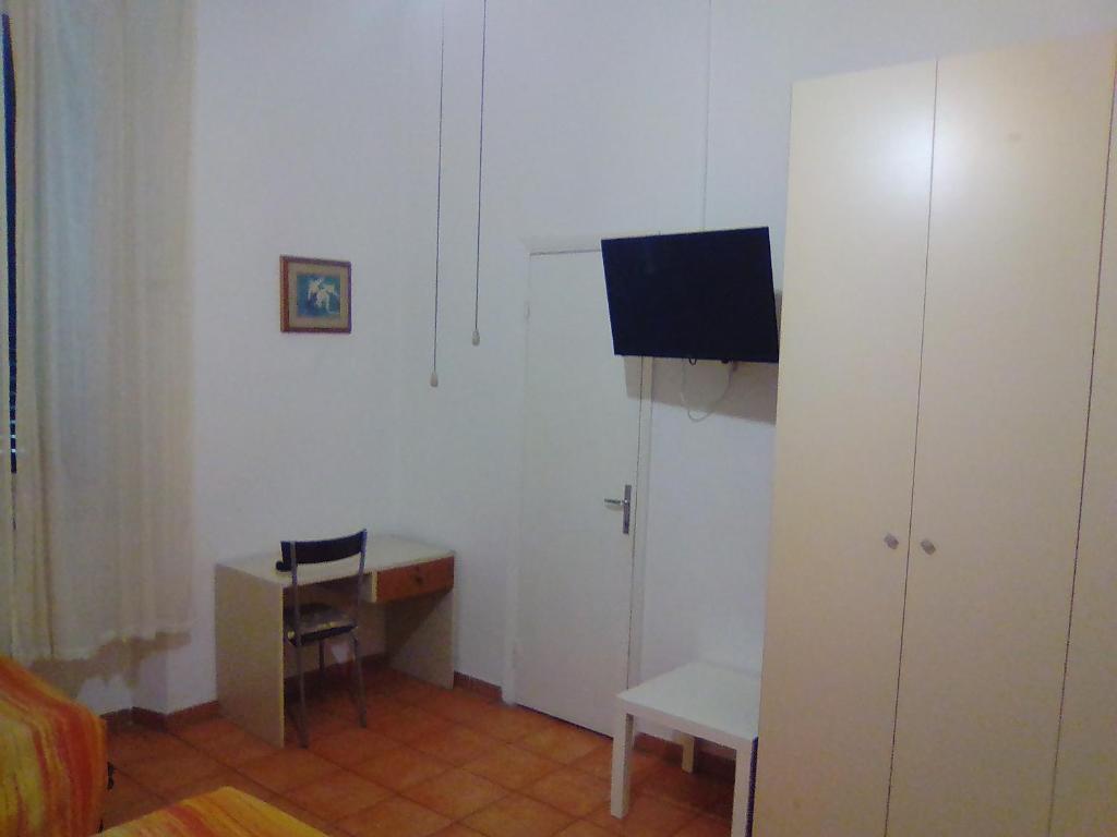 TV a/nebo společenská místnost v ubytování Albergo Cavour SELF CHECK-IN