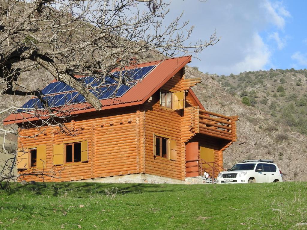 a house with a solar panel on top of it at Ranger Campus Eco Lodge in Urtsʼadzor