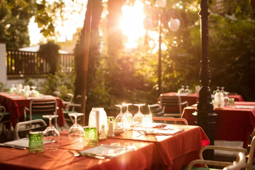 a table with wine glasses on top of it at Residenza d'Epoca Albergo Quattro Fontane in Venice-Lido