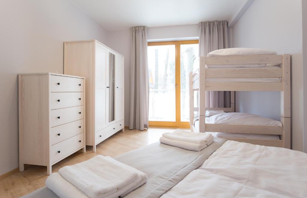 Posteľ alebo postele v izbe v ubytovaní Apart-Center Sienkiewicza