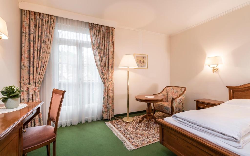Postel nebo postele na pokoji v ubytování Residence Hotel Gasser
