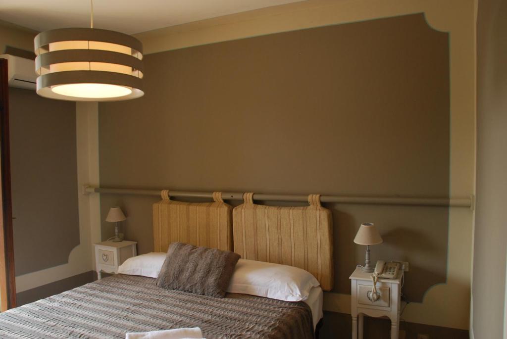 Postel nebo postele na pokoji v ubytování Hotel Andreis