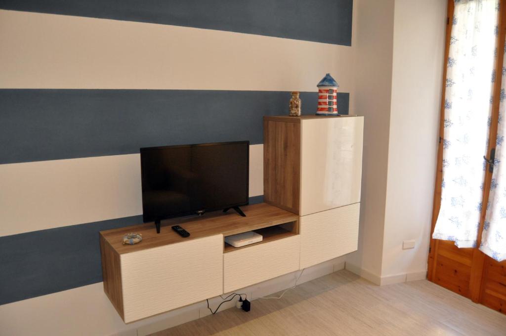 A television and/or entertainment centre at Nibea Suite