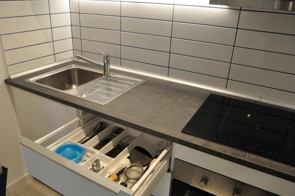 A kitchen or kitchenette at Nibea Suite