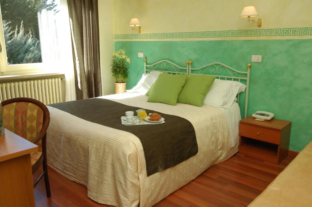 Postel nebo postele na pokoji v ubytování Park Hotel