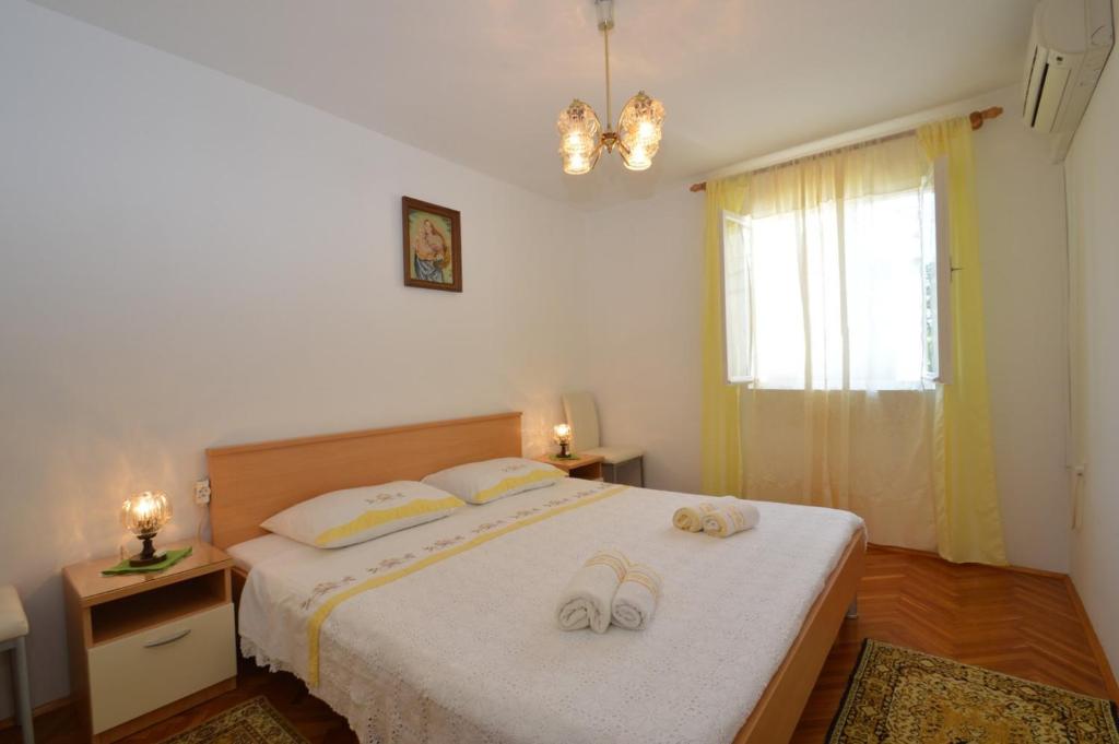 Posteľ alebo postele v izbe v ubytovaní House Orhideja