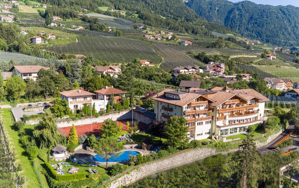 an aerial view of a resort in a vineyard at Hotel Erzherzog Johann in Schenna