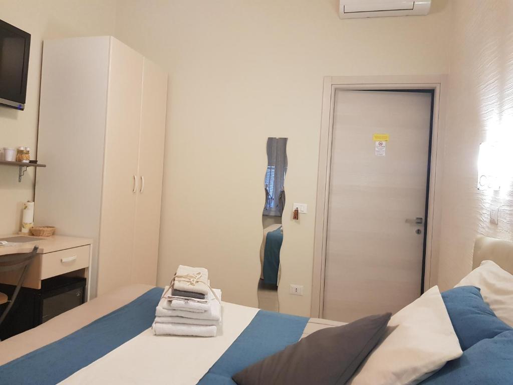 Postel nebo postele na pokoji v ubytování Il Quadrifoglio guesthouse