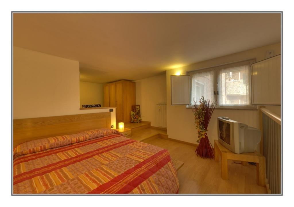 Postel nebo postele na pokoji v ubytování Borromeo Residenze Service s.a.s