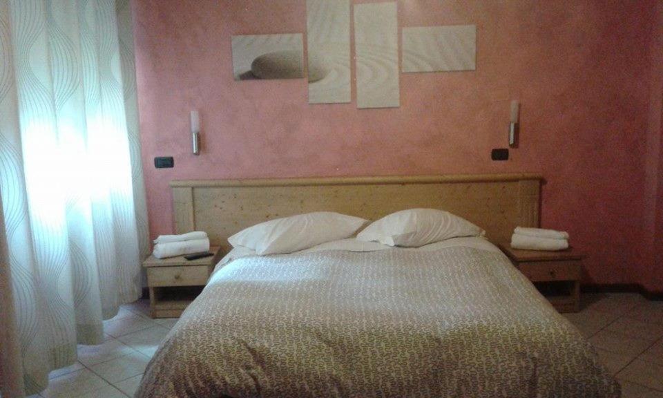 Postel nebo postele na pokoji v ubytování Borromeo Residenze Service s.a.s