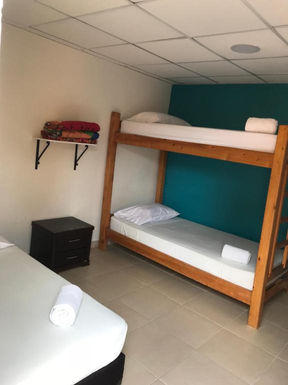 Postel nebo postele na pokoji v ubytování Hostal El Hangar