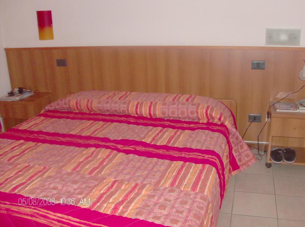 Postel nebo postele na pokoji v ubytování Borromeo Residenze Service s.a.s
