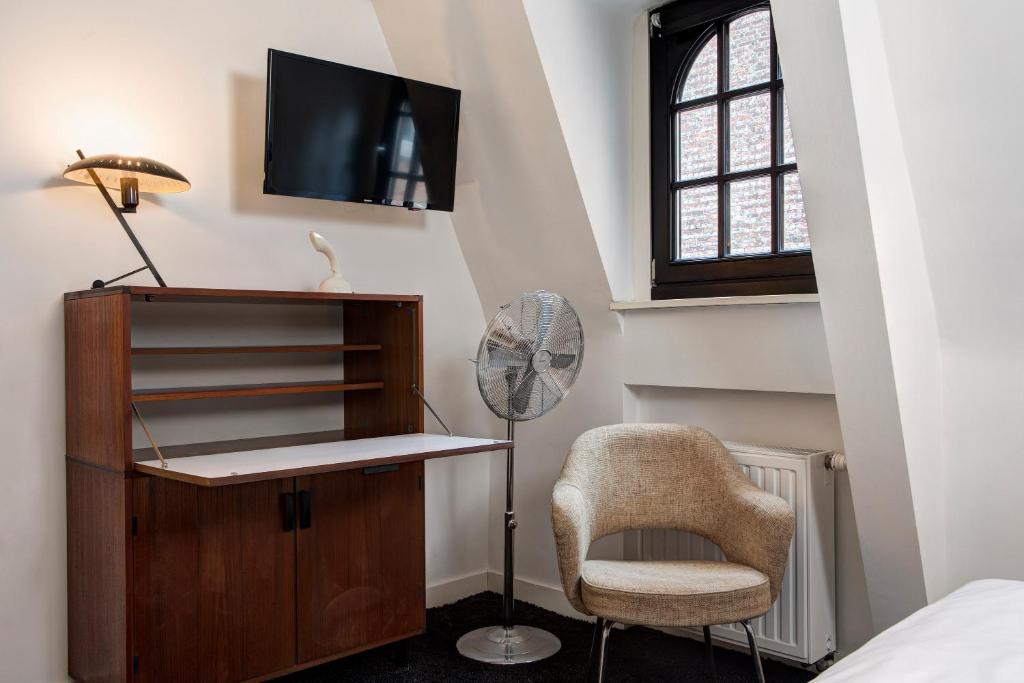 TV a/nebo společenská místnost v ubytování Vintage Hotel Brussels