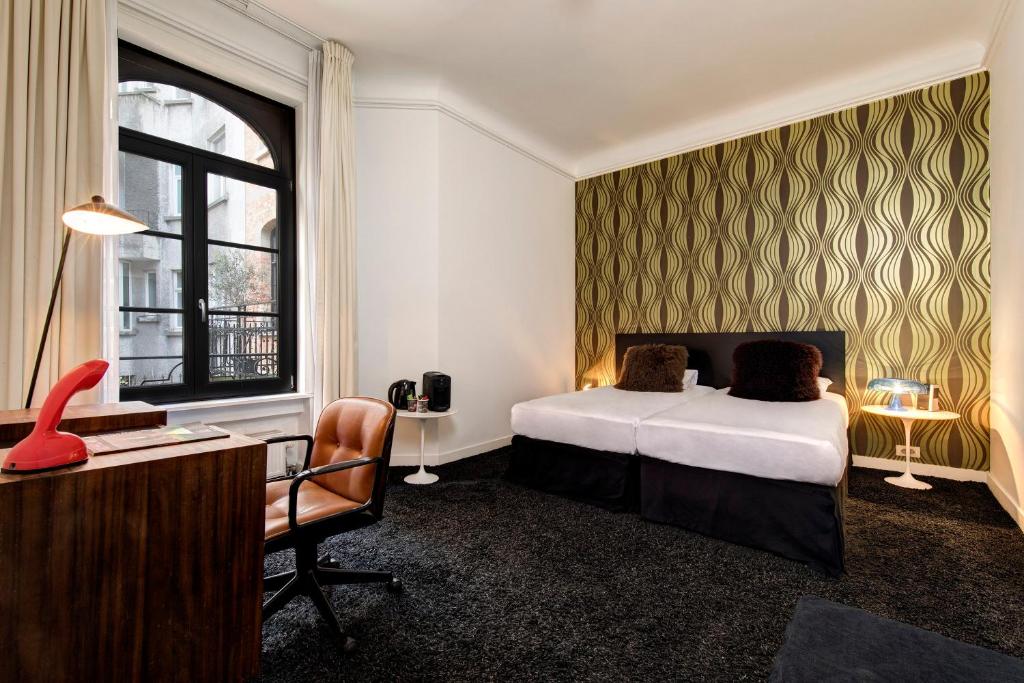 Postel nebo postele na pokoji v ubytování Vintage Hotel Brussels